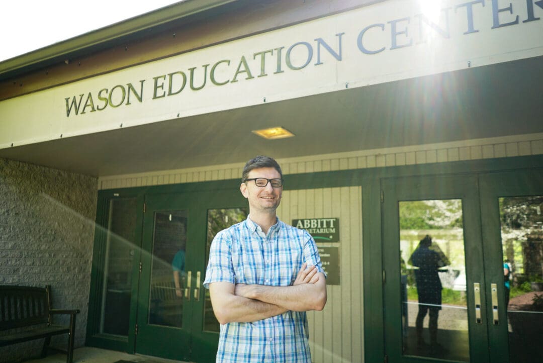 Michael Rutkowski stands out in front of the Wason Education Center where the Abbitt Planetarium is located.