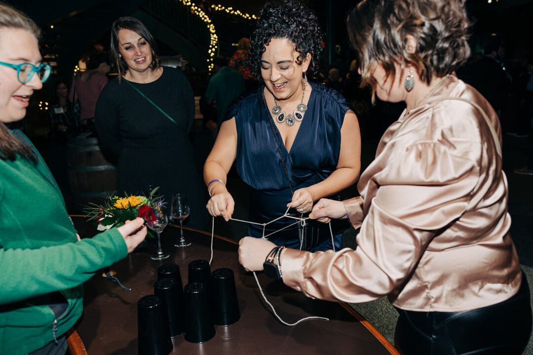 Guests work through a hands-on science experiment during Bacchus.