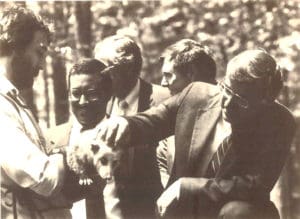 Gov. Gerald Baliles meets an opossum at the opening of the Virginia Living Museum in 1987.