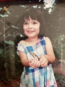 Clara Castle holds a butterfly on a visit to the Virginia Living Museum